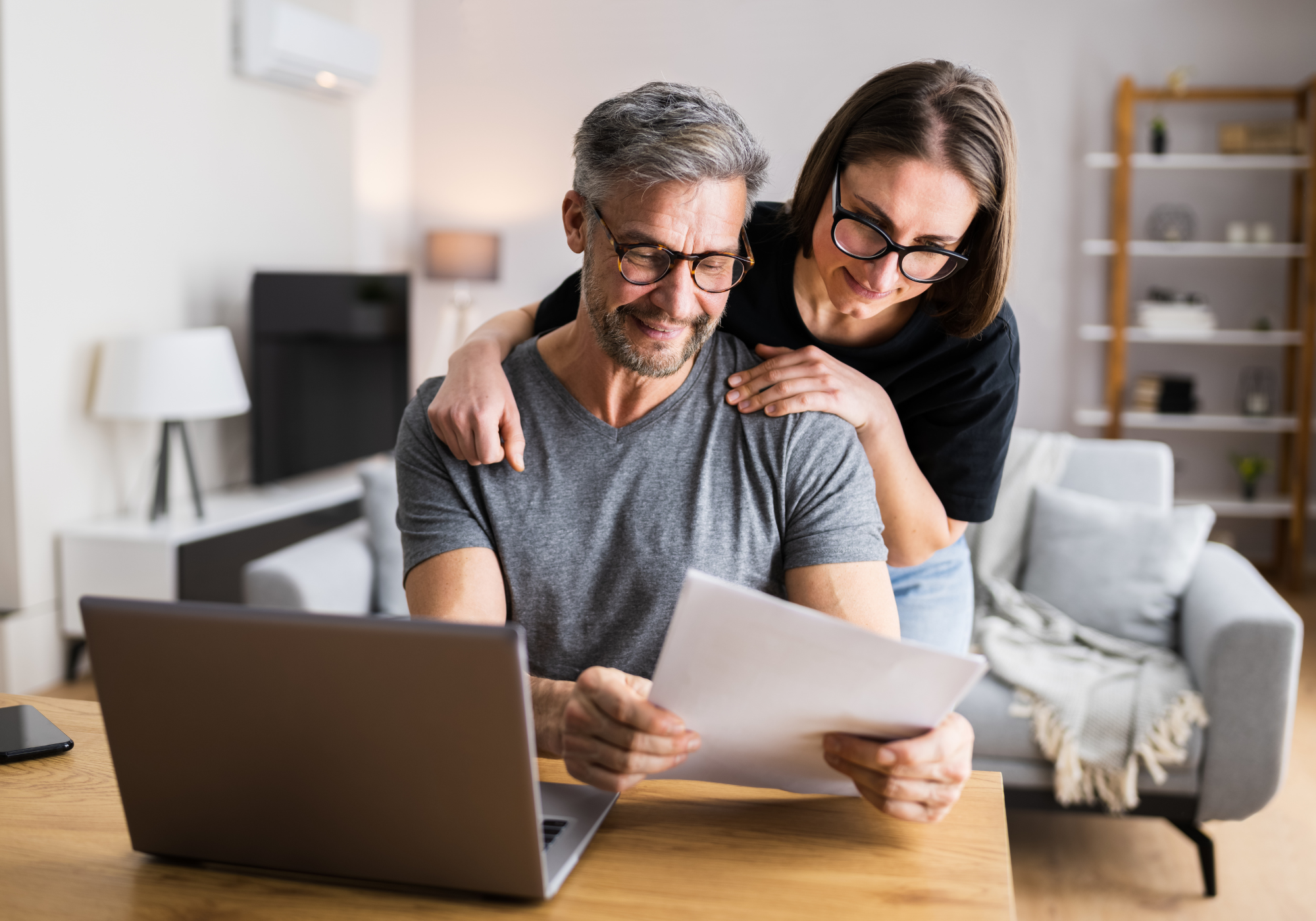 Person reviewing digital accounts on a laptop while planning their digital estate and online legacy.